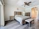 Bright main bedroom with hardwood floors, a ceiling fan and a bench seat at 1913 Blue River Rd, Holiday, FL 34691