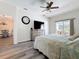 Main bedroom with luxury vinyl plank flooring and direct access to an outdoor lounge space at 1913 Blue River Rd, Holiday, FL 34691