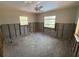 Bedroom with two windows, ready for remodel and new finishes at 16107 Gulf Blvd, Redington Beach, FL 33708