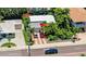 Beautiful home featuring lush tropical landscaping, a brick driveway, and a detached garage at 16107 Gulf Blvd, Redington Beach, FL 33708