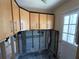 Kitchen view with upper cabinets, tiled floor and doorway to another room at 16107 Gulf Blvd, Redington Beach, FL 33708
