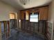 Kitchen features include upper cabinets, window over the sink, and tiled floor at 16107 Gulf Blvd, Redington Beach, FL 33708