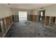 Spacious living room undergoing renovation with exposed framing elements at 16107 Gulf Blvd, Redington Beach, FL 33708