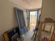 Hallway or storage room with blue door, awaiting completion and renovation at 16107 Gulf Blvd, Redington Beach, FL 33708