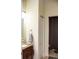 Cozy bathroom featuring a granite-topped vanity, decorative towel, and neutral wall color at 2906 Country Breeze Dr, Plant City, FL 33567