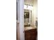 This bathroom features a single sink vanity with granite countertops, decorative mirror, and wall lighting at 2906 Country Breeze Dr, Plant City, FL 33567