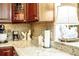 Close-up of kitchen countertop with decor, including a charming chicken lamp at 2906 Country Breeze Dr, Plant City, FL 33567