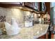 Kitchen countertop featuring lovely tile backsplash and granite countertops at 2906 Country Breeze Dr, Plant City, FL 33567