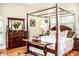 Spacious main bedroom with hardwood floors and decorative furnishings at 2906 Country Breeze Dr, Plant City, FL 33567