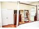 This main bedroom features a four poster bed, wood floors, and a bright window for natural light at 2906 Country Breeze Dr, Plant City, FL 33567