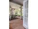 Charming screened-in porch with brick flooring and an outdoor dining set, perfect for entertaining at 2906 Country Breeze Dr, Plant City, FL 33567