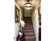 Staircase with stylish light fixture and Gathering portrait at 2906 Country Breeze Dr, Plant City, FL 33567