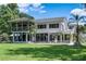 Expansive backyard with covered patio and fountain offers privacy and stunning views at 18620 Wayne Rd, Odessa, FL 33556