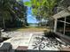 Private backyard with lush landscaping and access to the lake at 18620 Wayne Rd, Odessa, FL 33556