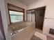 Bathroom featuring a luxurious tub and a separate shower at 18620 Wayne Rd, Odessa, FL 33556