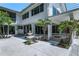 Private courtyard featuring a charming fountain and lush tropical landscaping at 18620 Wayne Rd, Odessa, FL 33556