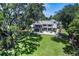 Secluded home on expansive lot with green lawn and mature trees at 18620 Wayne Rd, Odessa, FL 33556