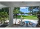 Picturesque outdoor patio with seating area, ideal for enjoying serene lake views at 18620 Wayne Rd, Odessa, FL 33556