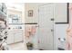 Functional bathroom with a sink, toilet, and white tiled walls at 251 Tropic W Blvd, Largo, FL 33770