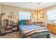 Relaxing bedroom with soft lighting, side table, and bed featuring soft pillows and a cozy comforter at 251 Tropic W Blvd, Largo, FL 33770