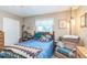 Inviting bedroom with comfortable armchair, with a bed featuring soft pillows and a cozy comforter at 251 Tropic W Blvd, Largo, FL 33770