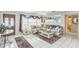 Inviting living room with tile flooring, comfortable seating, and lots of natural light at 251 Tropic W Blvd, Largo, FL 33770