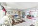 Bright living room with tile floors, comfortable seating, and an open layout at 251 Tropic W Blvd, Largo, FL 33770