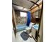 A rustic bathroom with stone walls, blue fixtures and a single vanity sink at 432 2Nd Ne Ave, Largo, FL 33770