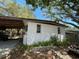 An exterior view of a home with a brick facade and a covered carport area at 432 2Nd Ne Ave, Largo, FL 33770