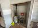 This utility closet with drywall features a water heater and plumbing fixtures at 432 2Nd Ne Ave, Largo, FL 33770