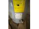 Close up of hot water heater with yellow energy efficiency label and manufacturer's specifications at 432 2Nd Ne Ave, Largo, FL 33770
