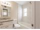 Updated bathroom showcasing a vanity with granite countertops and tiled shower and bathtub at 1020 58Th N Ave, St Petersburg, FL 33703