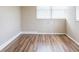 This bedroom has wood floors, neutral paint, and plenty of natural light at 1020 58Th N Ave, St Petersburg, FL 33703