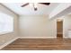 Bright living room with wood-look flooring and a large window for ample natural light at 1020 58Th N Ave, St Petersburg, FL 33703