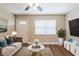 Cozy living room with hardwood floors and ample natural light at 1020 58Th N Ave, St Petersburg, FL 33703