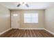 Bright living room with hardwood floors and a ceiling fan at 1020 58Th N Ave, St Petersburg, FL 33703