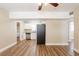 Open-concept living room showcases wood-look flooring and a seamless flow into other areas at 1020 58Th N Ave, St Petersburg, FL 33703
