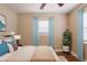 Comfortable main bedroom featuring hardwood floors, neutral paint, and bright natural light at 1020 58Th N Ave, St Petersburg, FL 33703