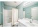 Bathroom with tub shower, a curtain, toilet, and sink at 2015 Gardenia Landings Ln, Sun City Center, FL 33573