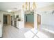Open-concept kitchen with stainless steel appliances, an adjacent dining area, and easy access to other living spaces at 2015 Gardenia Landings Ln, Sun City Center, FL 33573
