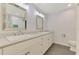 Bright bathroom with double sink vanity, quartz countertop and tile flooring at 2504 Tanglewood Dr, Sarasota, FL 34239