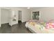 Bedroom with view of ensuite bath and sliding doors to screened patio at 2504 Tanglewood Dr, Sarasota, FL 34239