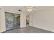 Spacious bedroom with tile floors leading to a screened lanai and backyard view at 2504 Tanglewood Dr, Sarasota, FL 34239