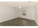 Bright bedroom with ceiling fan, tile flooring, and a window offering natural light at 2504 Tanglewood Dr, Sarasota, FL 34239