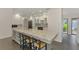Spacious kitchen featuring granite countertops, stainless steel appliances, and large island at 2504 Tanglewood Dr, Sarasota, FL 34239