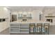 Bright kitchen featuring a spacious island with granite countertops, pendant lighting, and modern appliances at 2504 Tanglewood Dr, Sarasota, FL 34239