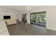 Bright living room with tile floors, large sliding doors, and chandelier at 2504 Tanglewood Dr, Sarasota, FL 34239