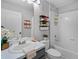 Modern bathroom featuring a sleek vanity, clean white tiles, and stylish chrome fixtures at 12829 Kings Lake Dr, Gibsonton, FL 33534
