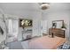 Inviting bedroom with attached bathroom, wood-style flooring, and ample natural light at 12829 Kings Lake Dr, Gibsonton, FL 33534