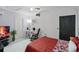 Spacious bedroom with desk area, ample lighting, and comfortable rocking chair provides a relaxing atmosphere at 12829 Kings Lake Dr, Gibsonton, FL 33534